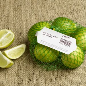 Limes in a bag, displaying a barcode